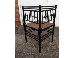 Liberty and Co. An Aesthetic Movement ebonised corner chair and side chair after a design by Ford Maddox Brown. - Thumbnail 3