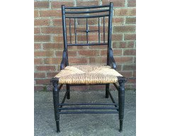 Liberty and Co. An Aesthetic Movement ebonised corner chair and side chair after a design by Ford Maddox Brown. - Thumbnail 8