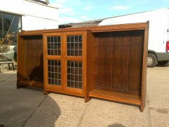 Liberty and Co. A quality Arts and Crafts oak breakfront cascading waterfall bookcase  - Thumbnail 1
