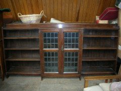 Liberty and Co. A quality Arts and Crafts oak breakfront cascading waterfall bookcase  - Thumbnail 2