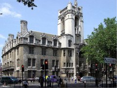 The Middlesex Guildhall and Tony Geering with the original clock he saved and returned to The Guildhall - Thumbnail 1