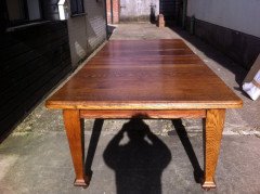 A good quality twelve seater Arts and Crafts extending oak dining table with two extra leaves. - Thumbnail 3