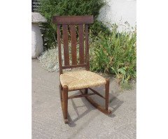 An Arts and Crafts oak rocking chair - Thumbnail 1