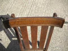 An Arts and Crafts oak rocking chair - Thumbnail 4