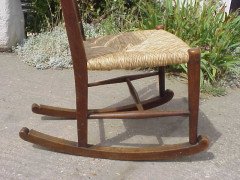 An Arts and Crafts oak rocking chair - Thumbnail 7