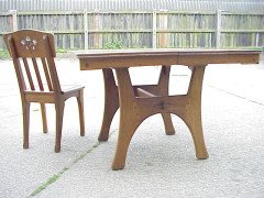 A French Arts and Crafts oak extending dining table - Thumbnail 1