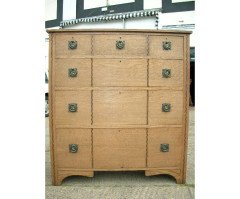 An Arts and Crafts oak inlaid chest of drawers - Thumbnail 1