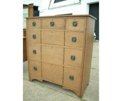An Arts and Crafts oak inlaid chest of drawers - Thumbnail 2