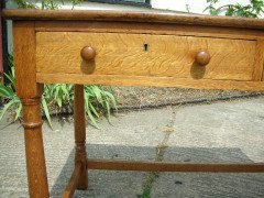 Heals of London. An oak Arts and Crafts Cotswold style two drawer desk - Thumbnail 4