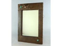 Liberty and Co. An Arts and Crafts mirror by Liberty and Co. - Thumbnail 1