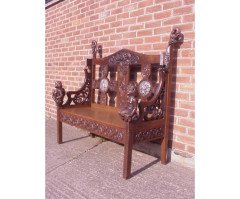 A Celtic Arts and Crafts carved oak settle with carved dragons to the tops - Thumbnail 3
