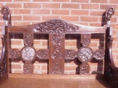 A Celtic Arts and Crafts carved oak settle with carved dragons to the tops - Thumbnail 7