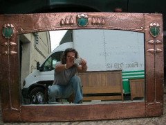 Talwin Morris (style of). A Glasgow School mirror with stylised floral repousse copper work - Thumbnail 1
