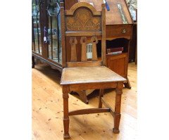 Shapland and Petter. An Arts and Crafts oak chair with arched top and wonderful Peacock inlays - Thumbnail 1