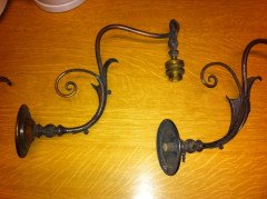 A pair of Arts and Crafts wall lights with floral leaf and scroll work decoration to the arms. - Thumbnail 2