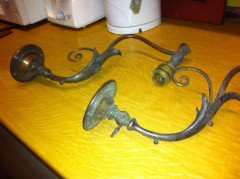 A pair of Arts and Crafts wall lights with floral leaf and scroll work decoration to the arms. - Thumbnail 3