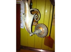 A pair of Arts and Crafts wall lights with floral leaf and scroll work decoration to the arms. - Thumbnail 5