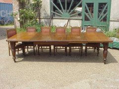 A Gothic revival oak extending dining table with three extra leaves - Thumbnail 1