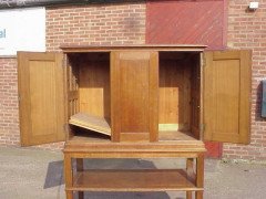 An Arts and Crafts oak cabinet with large internal cupboard - Thumbnail 3