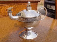 A E Jones. An oil lamp and lighting stick with inscription running round - Thumbnail 2
