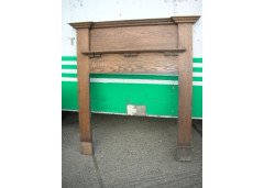 An Arts and Crafts oak fire surround - Thumbnail 1