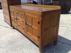Peter Rabbitman Heap. An oak sideboard. - Thumbnail 2