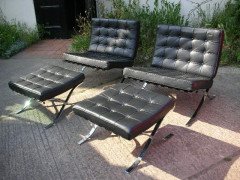 Mies Van Der Rhoe. A pair of black leather and Chrome Barcelona chairs with matching Ottomans/stools - Thumbnail 1