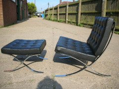 Mies Van Der Rhoe. A pair of black leather and Chrome Barcelona chairs with matching Ottomans/stools - Thumbnail 3