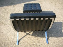 Mies Van Der Rhoe. A pair of black leather and Chrome Barcelona chairs with matching Ottomans/stools - Thumbnail 4