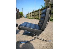Mies Van Der Rhoe. A pair of black leather and Chrome Barcelona chairs with matching Ottomans/stools - Thumbnail 5