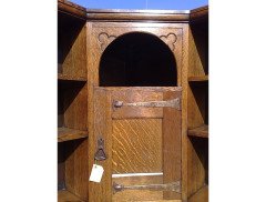 Liberty and Co. An Arts and Crafts oak corner bookcase - Thumbnail 5