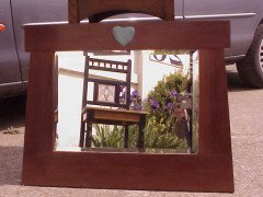 An Arts and Crafts mahogany style mirror with subtle angular form with a light blue Ruskin Heart to the top - Thumbnail 1