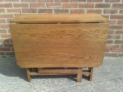 Liberty and Co. A good quality large Arts and Crafts oak drop leaf dining - Thumbnail 5