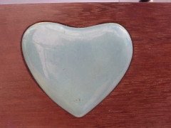 An Arts and Crafts mahogany style mirror with subtle angular form with a light blue Ruskin Heart to the top - Thumbnail 4