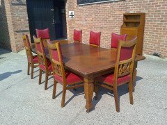 Shapland and Petter. An Arts and Crafts oak 14 seater extending dining table with three leaves and eight matching chairs - Thumbnail 1