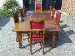 Shapland and Petter. An Arts and Crafts oak 14 seater extending dining table with three leaves and eight matching chairs - Thumbnail 2