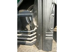 An Arts and Crafts fireplace with stylized floral details - Thumbnail 4