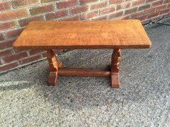 An Arts Crafts oak adzed coffee table with mouse running up the leg - Thumbnail 4