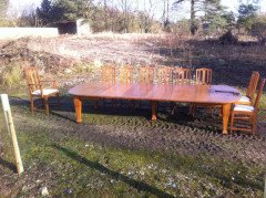 A fourteen seat Arts and Crafts oak 'D' end extending dining table with four extra leaves. - Thumbnail 1
