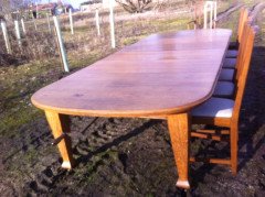 A fourteen seat Arts and Crafts oak 'D' end extending dining table with four extra leaves. - Thumbnail 2