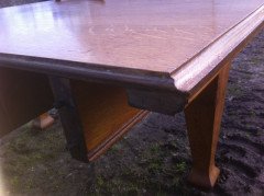 A fourteen seat Arts and Crafts oak 'D' end extending dining table with four extra leaves. - Thumbnail 7