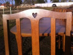 A fourteen seat Arts and Crafts oak 'D' end extending dining table with four extra leaves. - Thumbnail 16