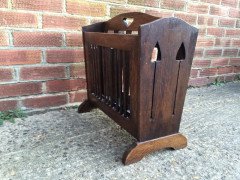 Liberty and Co. An Arts and Crafts oak Canterbury with stylised cut-outs to the ends. - Thumbnail 2