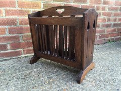 Liberty and Co. An Arts and Crafts oak Canterbury with stylised cut-outs to the ends. - Thumbnail 3