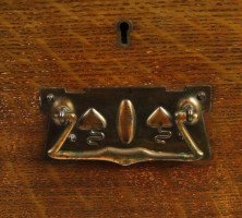 An Arts and Crafts oak chest of drawers with good stylised copper handles - Thumbnail 4