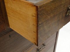 An Arts and Crafts oak chest of drawers with good stylised copper handles - Thumbnail 5