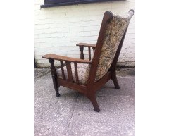 An Arts and Crafts oak reclining armchair with large flat extended arms - Thumbnail 4