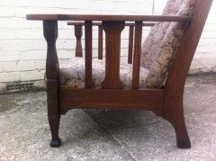An Arts and Crafts oak reclining armchair with large flat extended arms - Thumbnail 5