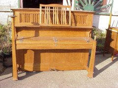Walter Cave for Bechstein. An oak piano with an overstrung upright underdamper action - Thumbnail 1