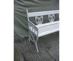 A pair of successionist cast iron garden seats with a matching four seater bench. - Thumbnail 3